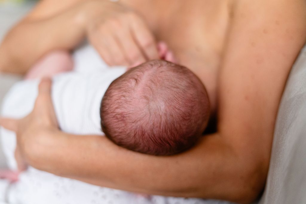 Photo of an infant breastfeeding